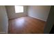 Empty bedroom with light-colored walls and light wood-look vinyl plank flooring at 19820 N 13Th N Ave # 282, Phoenix, AZ 85027