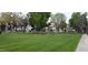 Expansive lawn and community green space featuring picnic tables and mature trees at 19820 N 13Th N Ave # 282, Phoenix, AZ 85027