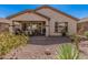 Backyard featuring a covered patio, desert landscaping, and a tranquil setting at 208 W Lantern Way, San Tan Valley, AZ 85143