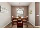 Cozy dining room with a round table and natural light from the window at 208 W Lantern Way, San Tan Valley, AZ 85143