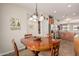 Comfortable dining area adjacent to the kitchen with ample seating and natural light at 208 W Lantern Way, San Tan Valley, AZ 85143