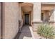 Inviting front entrance featuring a decorative door and stucco walls at 208 W Lantern Way, San Tan Valley, AZ 85143