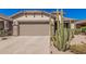 Lovely home featuring a desert landscape, a two-car garage, and an inviting entrance at 208 W Lantern Way, San Tan Valley, AZ 85143