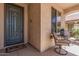 Cozy front porch with seating area, perfect for enjoying the outdoors at 208 W Lantern Way, San Tan Valley, AZ 85143