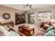 Comfortable living room with entertainment center and neutral color scheme at 208 W Lantern Way, San Tan Valley, AZ 85143