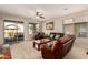 Spacious living room featuring a ceiling fan and sliding door to patio at 208 W Lantern Way, San Tan Valley, AZ 85143