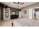 Large main bedroom with soft carpet, exterior door, and ensuite bathroom at 208 W Lantern Way, San Tan Valley, AZ 85143