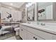 Bathroom with double sinks, decorative mirror, and artistic shower curtain at 20846 E Longwood Dr, Queen Creek, AZ 85142