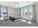 Bright bedroom with ceiling fan, and natural light from large windows at 20846 E Longwood Dr, Queen Creek, AZ 85142