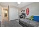 Bedroom with a desk, Bugatti banner, closet, and nearby laundry room at 20846 E Longwood Dr, Queen Creek, AZ 85142