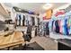 A spacious walk-in closet boasts ample shelving, a desk, and good lighting at 20846 E Longwood Dr, Queen Creek, AZ 85142