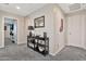 Well-lit hallway with a stylish console table, modern decor, and neutral paint throughout at 20846 E Longwood Dr, Queen Creek, AZ 85142