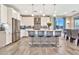 Bright kitchen features a large island with seating, pendant lights, and stainless steel appliances at 20846 E Longwood Dr, Queen Creek, AZ 85142