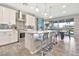 Modern kitchen with stainless steel appliances, quartz countertops, and a breakfast bar at 20846 E Longwood Dr, Queen Creek, AZ 85142