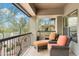 Charming balcony area with comfortable seating, perfect for enjoying outdoor relaxation and scenic neighborhood views at 21320 N 56Th St # 2005, Phoenix, AZ 85054