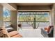 Spacious outdoor balcony featuring comfortable lounge furniture and serene views of the surrounding community at 21320 N 56Th St # 2005, Phoenix, AZ 85054