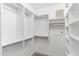 Spacious walk-in closet with custom shelving and ample storage space, ready for organization at 21320 N 56Th St # 2005, Phoenix, AZ 85054