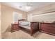 Bedroom features a ceiling fan, carpet flooring, and shuttered window at 2640 S Terripin Cir, Mesa, AZ 85209