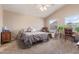 Spacious bedroom features a vaulted ceiling, neutral decor, and bright natural light at 2640 S Terripin Cir, Mesa, AZ 85209