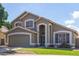 The exterior of this two-story home features a two-car garage and inviting curb appeal at 2640 S Terripin Cir, Mesa, AZ 85209