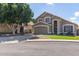 Two-story home with a two-car garage and a well-manicured lawn on a sunny day at 2640 S Terripin Cir, Mesa, AZ 85209