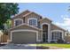 The exterior of this two-story home features a two-car garage and inviting curb appeal at 2640 S Terripin Cir, Mesa, AZ 85209