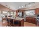 Open concept kitchen with stainless steel appliances and stone countertops at 2640 S Terripin Cir, Mesa, AZ 85209