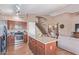 Open concept kitchen with hardwood floors and a view of the staircase at 2640 S Terripin Cir, Mesa, AZ 85209