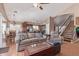 Open-concept living area with a staircase, hardwood floors, and a view of the kitchen at 2640 S Terripin Cir, Mesa, AZ 85209