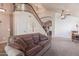 Cozy living room featuring hardwood floors, neutral paint, and a staircase at 2640 S Terripin Cir, Mesa, AZ 85209