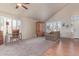 Bright living room with large windows, plantation shutters, and a cozy seating area at 2640 S Terripin Cir, Mesa, AZ 85209