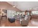 Bright living room featuring a vaulted ceiling, an open floor plan, and access to a pool at 2640 S Terripin Cir, Mesa, AZ 85209