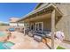 Covered outdoor patio area featuring ample seating and string lights at 2640 S Terripin Cir, Mesa, AZ 85209