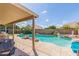 Inviting backyard pool and outdoor kitchen area, ideal for entertaining at 2640 S Terripin Cir, Mesa, AZ 85209