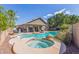 Backyard pool and hot tub area surrounded by desert landscaping at 2640 S Terripin Cir, Mesa, AZ 85209