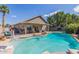 Beautiful pool and hot tub surrounded by desert landscaping and artificial turf at 2640 S Terripin Cir, Mesa, AZ 85209