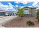 Charming single-story home features a well-maintained front yard and long driveway at 265 W Rainbow Bridge Ln, San Tan Valley, AZ 85140