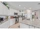 Bright kitchen featuring stainless steel appliances, granite countertops, and white cabinetry at 265 W Rainbow Bridge Ln, San Tan Valley, AZ 85140