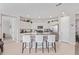 Modern kitchen features white cabinetry, stainless steel appliances, and granite countertops at 265 W Rainbow Bridge Ln, San Tan Valley, AZ 85140