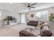 Comfortable living room with a ceiling fan and sliding glass doors at 265 W Rainbow Bridge Ln, San Tan Valley, AZ 85140