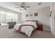 Comfortable main bedroom featuring a ceiling fan and lots of natural light at 265 W Rainbow Bridge Ln, San Tan Valley, AZ 85140