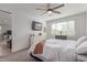 Comfortable main bedroom with ceiling fan and lots of natural light from the window at 265 W Rainbow Bridge Ln, San Tan Valley, AZ 85140