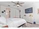 Bright main bedroom features a large ceiling fan and an en-suite bathroom at 265 W Rainbow Bridge Ln, San Tan Valley, AZ 85140