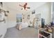 Bright bedroom with window and ceiling fan at 27255 N 81St Ln, Peoria, AZ 85383