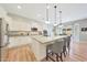 Bright and modern kitchen with granite countertops, stainless steel appliances, and a large center island with seating at 27255 N 81St Ln, Peoria, AZ 85383