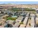 An aerial view of residential houses, the community pool, a baseball field, and mountain views at 280 S Evergreen Rd # 1336, Tempe, AZ 85288