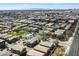 A wide-angle aerial view showcases a large residential area with a community pool and surrounding streets at 280 S Evergreen Rd # 1336, Tempe, AZ 85288