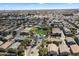 An aerial view captures a community pool nestled among residences, showcasing organized neighborhood planning at 280 S Evergreen Rd # 1336, Tempe, AZ 85288