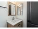 A modern bathroom featuring a wood vanity, white sink, a square framed mirror, and dark hardware at 280 S Evergreen Rd # 1336, Tempe, AZ 85288