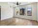 A vacant bedroom featuring hardwood floors, three windows, and neutral wall color at 280 S Evergreen Rd # 1336, Tempe, AZ 85288